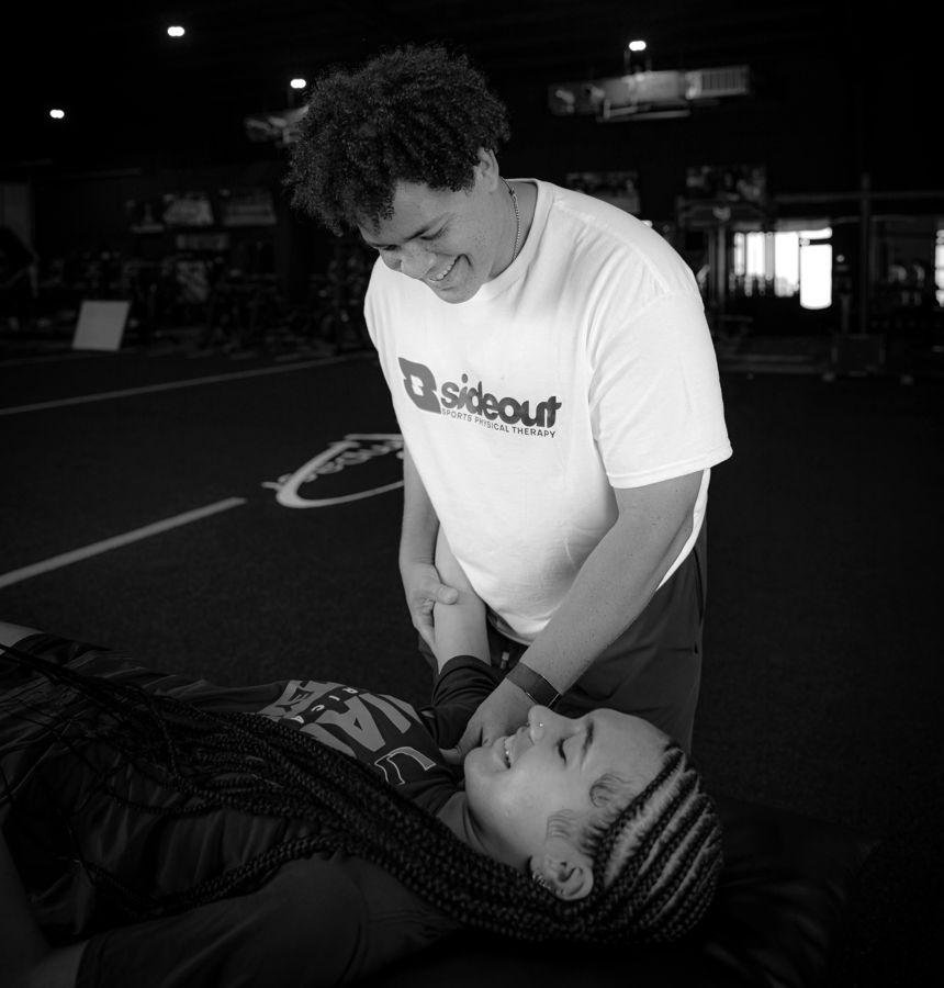 Dr. Bobby Moore treating an injured athlete